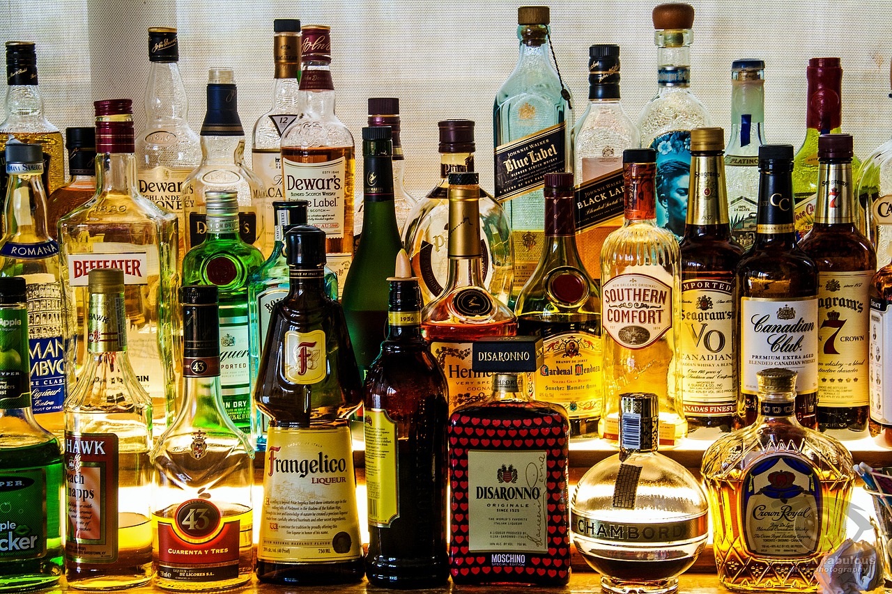 Alcohol bottles on bar shelves - Alcohol and gray matter of brain impact