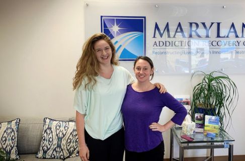 Arielle Seidler and Corinne Burnett in front of MARC sign - MARC Clinical Team