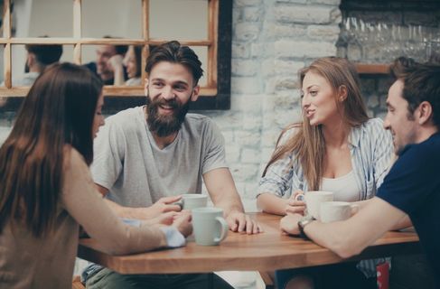 sober friends hanging out together drinking coffee - Community living treatment