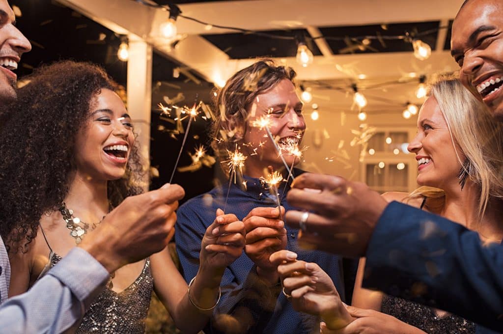 people partying at home - tips for hosting a sober guest concept