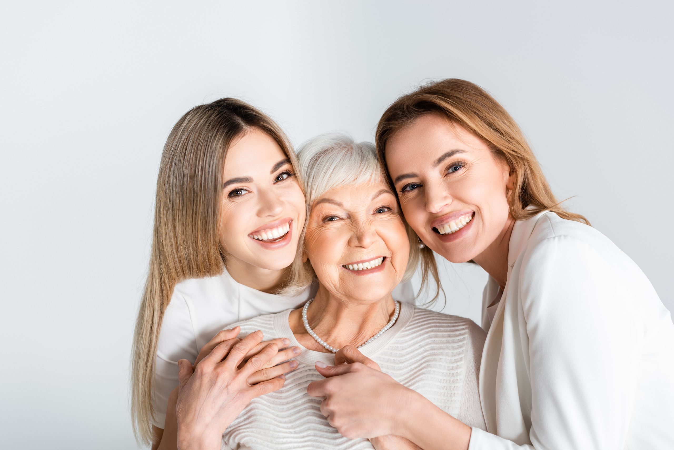 grandmother, mother, and daughter happy - healing generational trauma concept